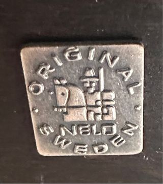 Sillón de piel marrón con puff Nelo Roche Bobois