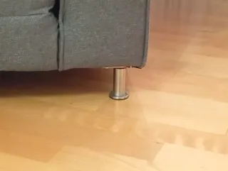 Sofá cama gris de tela