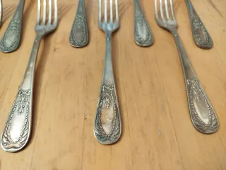 Juego 12 cubiertos baño plata