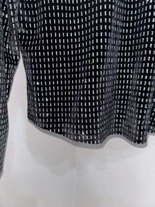 Jersey negro con brillos plateados