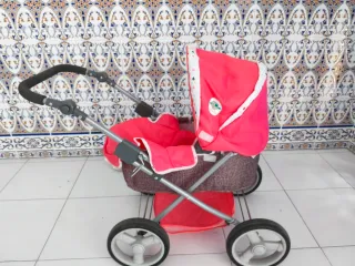 2 Carritos de muñecas uno azul y otro rosa