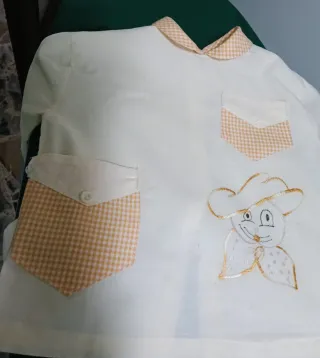 Grembiulino neonato con tasche e disegno