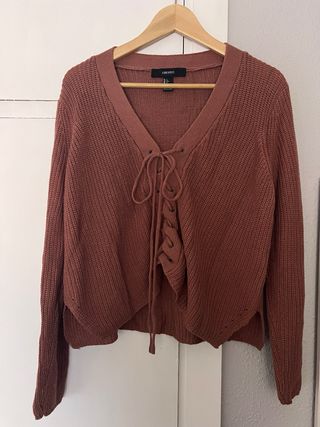 Cárdigan de punto rosa con cordones