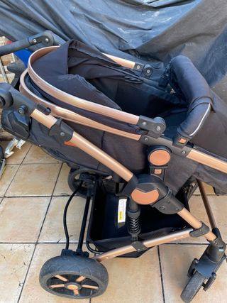 Silla de paseo negra y broncee