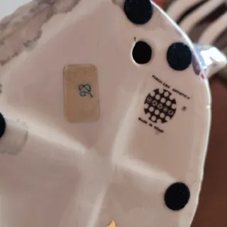 Figura de porcelana mujer sentada