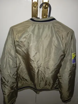 Cazadora bomber Kelme verde y rosa Talla S