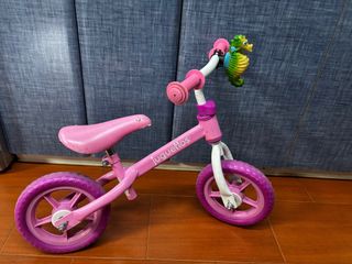 Bici sin pedales rosa con caballito de mar