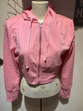 Jersey rosa finito con cremallera y capucha