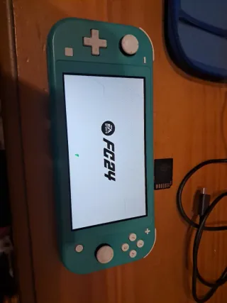 Nintendo Switch Lite Blu + 4 Giochi + Custodia