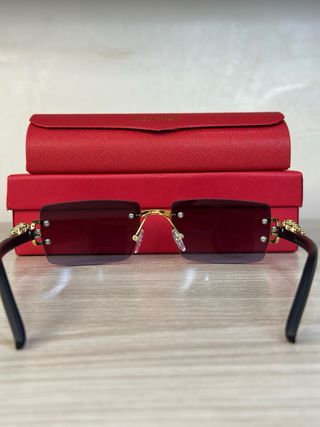 Occhiali da sole Cartier oro e neri