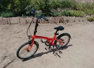 Bicicleta plegable naranja fluor Btwin