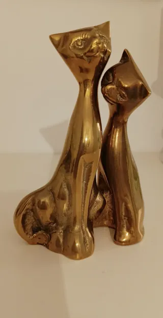 Pareja de gatos decorativos dorados