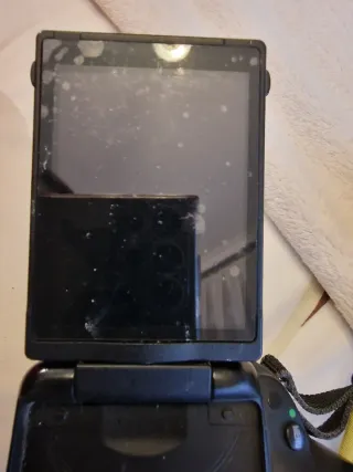 Cámara Nikon D5100 con accesorios