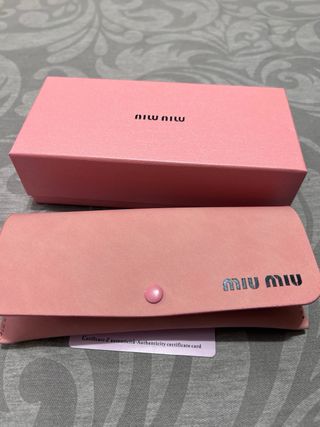 Gafas de sol Miu Miu plateadas y negras