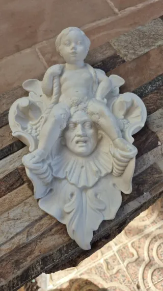 Figura porcelana colgante querubín y cara