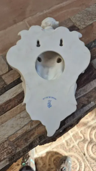 Figura porcelana colgante querubín y cara