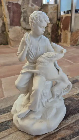 Figura porcelana niño y perro