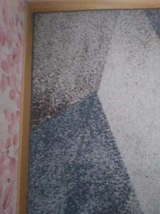 Alfombra geométrica azul y gris