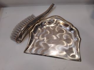 Recogemigas de metal plateado