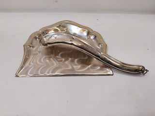 Recogemigas de metal plateado