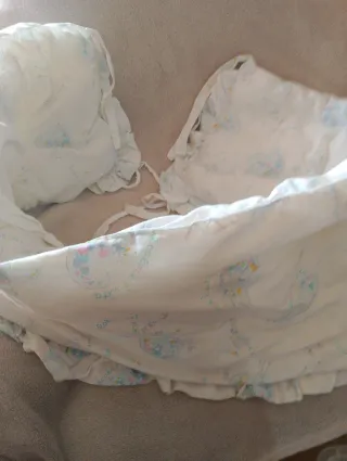 Protezione per culla con paracolpi