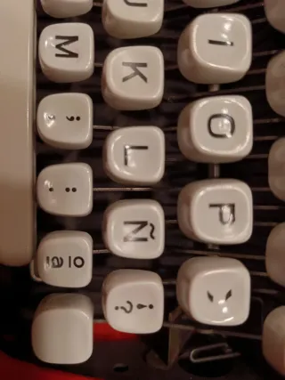 Máquina de escribir Hermes Baby Naranja vintage