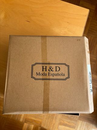 Botas altas negras con flecos y tachuelas