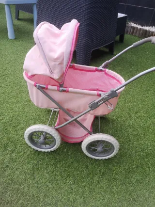 Carrito de muñecas rosa