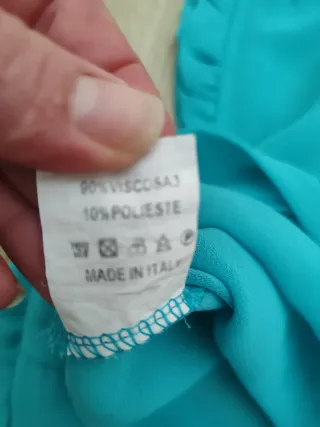 Top con fiocco e perle