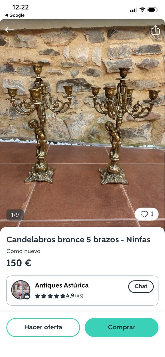 Candelabro antiguo de bronce con figuras