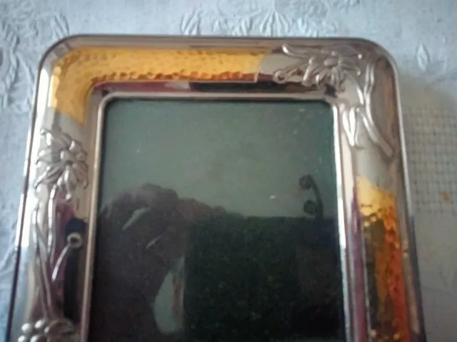 Marco de fotos plateado y dorado