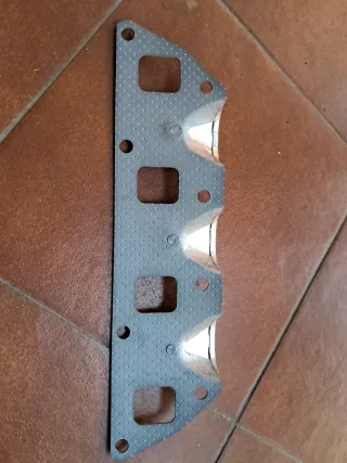 SUZUKI SJ410. JUNTA COLECTOR DE ESCAPE.