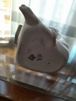 Lladró Nao niño leyendo porcelana