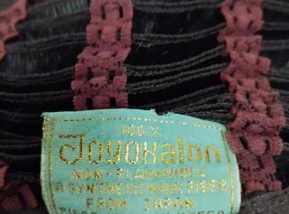 Peluca natural cabello corto negra con ondas.