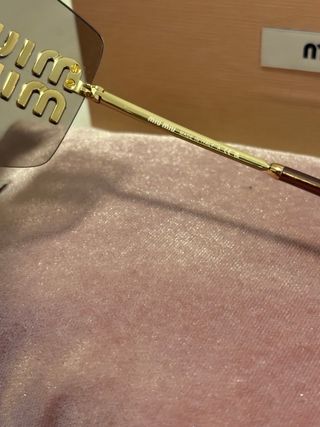 Gafas de sol Miu Miu marrones y doradas