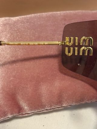 Gafas de sol Miu Miu marrones y doradas