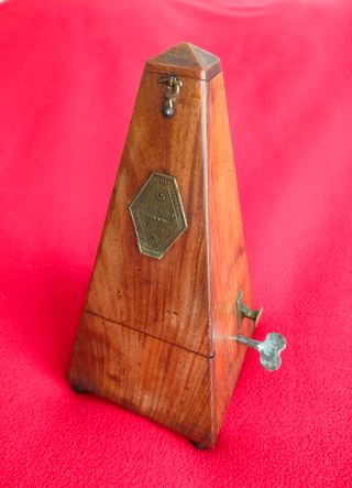 Metrónomo muy antiguo madera con campana