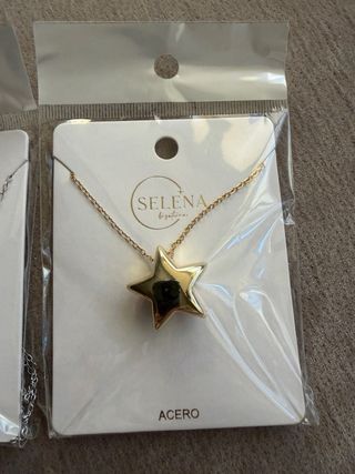 2 colgantes de Acero con estrella en dorad y plata
