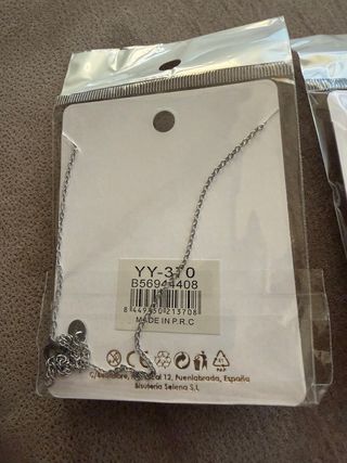 2 colgantes de Acero con estrella en dorad y plata