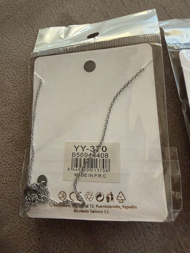 2 colgantes de Acero con estrella en dorad y plata