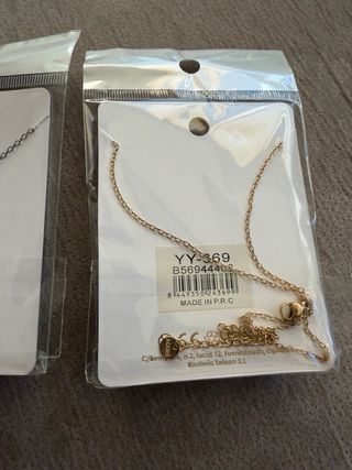 2 colgantes de Acero con estrella en dorad y plata