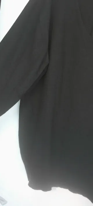 Amplio jersey de punto fino.