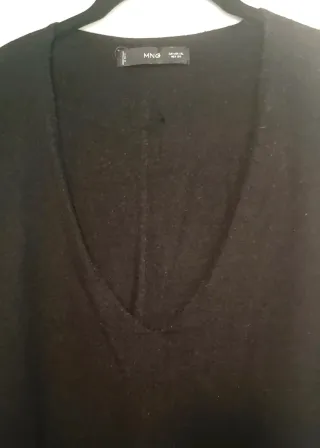 Amplio jersey de punto fino.