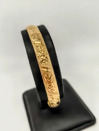 Pulsera rígida tipo caña oro 18kt labrada