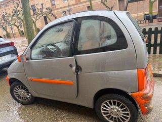 Coche sin carnet gris y naranja