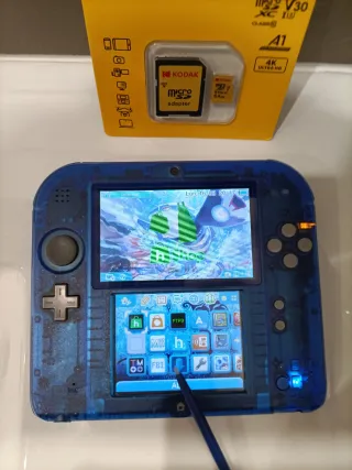 Nintendo 2DS edición especial 64gb juegos transp.