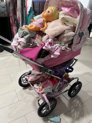 Coche de bebé reborn rosa con capazo