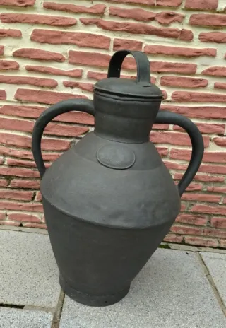 Lechera antigua de metal