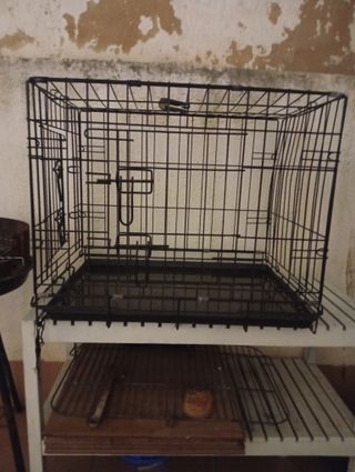 Jaula para perros negra y blanca