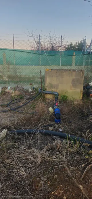 Parcela Rústica con dos casas prefabricada